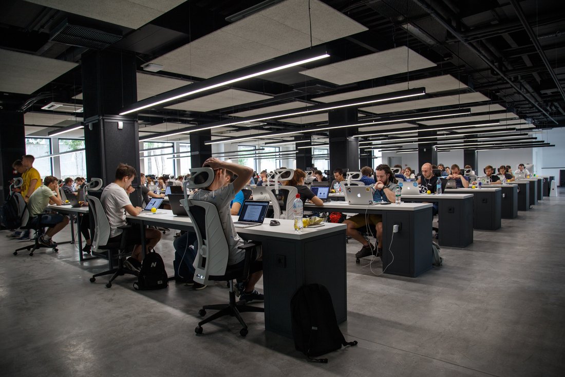 Photo by Alex Kotliarskyi on Unsplash Open plan office with many people at many computers